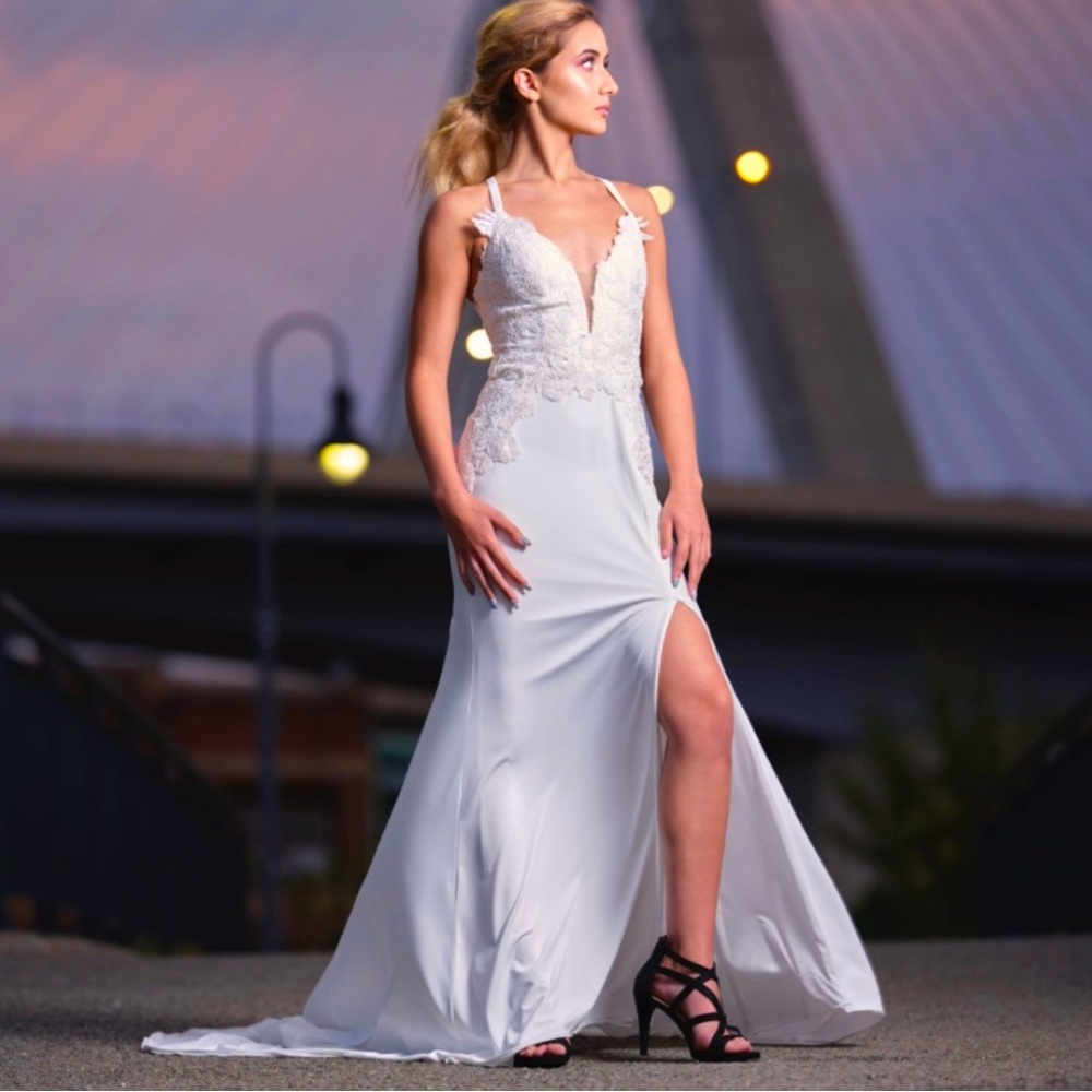 Elegant ivory evening gown with lace detail and subtle sparkle!